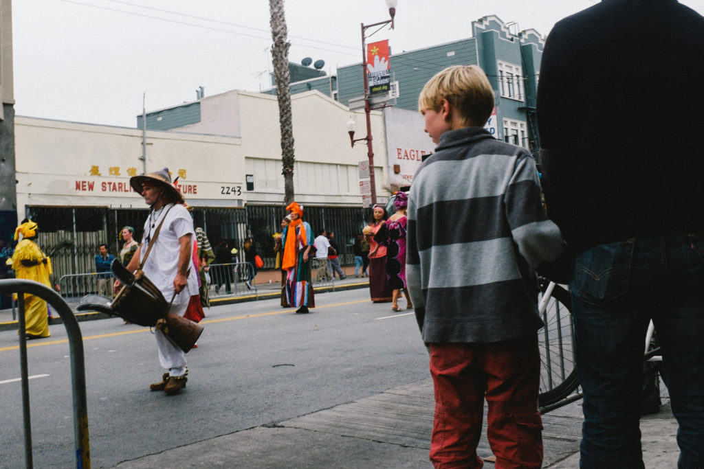 Boy watching drummer, Mission, SF