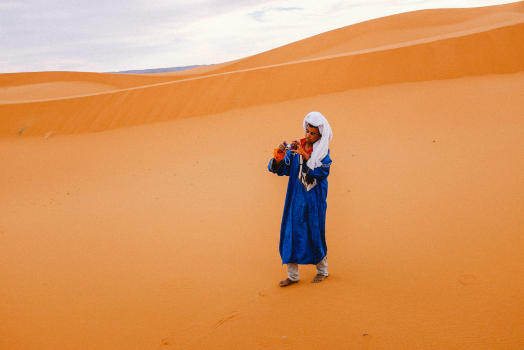 Guide taking our photo in the Sahara Desert