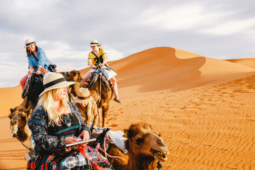 Our camel-bound travel group in the Sahara